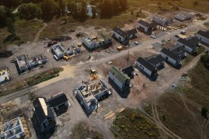 New private housing development construction in rural countryside aerial view. Drone photo.